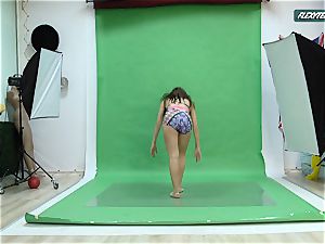 immense boobies Nicole on the green screen opening up